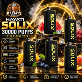 Five Hayati Solix 30000 Puffs Disposable Vape devices with gold lettering on a dark rocky surface